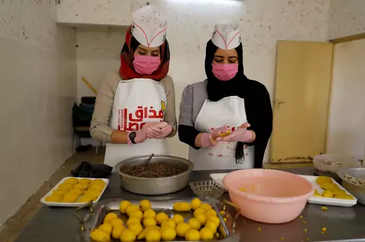 Iraqi women prepare food in kitchen run by Mahiya Yousef, who created her business in order to help unemployed women in Mosul.