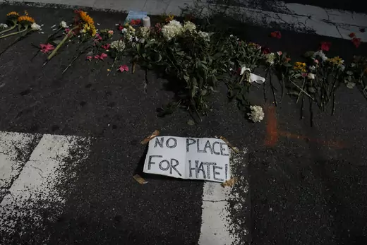Flowers lie at a makeshift memorial at the scene of where a car plowed into counter-protesters in Charlottesville