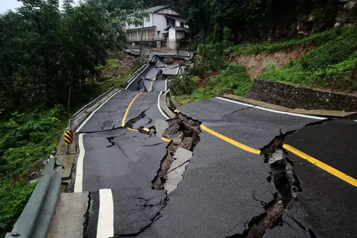 Road damaged by a landslide following heavy rainfall is seen in Chongqing, China