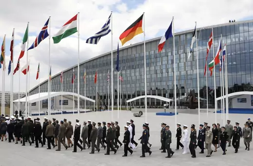 Military officers from NATO and other countries parade during the opening ceremony of the NATO (North Atlantic Treaty Organization) summit, at the NATO headquarters in Brussels, Belgium, July 11, 2018.