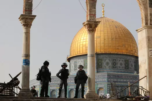Israeli police stand in front of the Dome of the Rock during clashes with Palestinians at the compound that houses Al-Aqsa Mosque, known to Muslims as Noble Sanctuary and to Jews as Temple Mount, in Jerusalem's Old City, May 10, 2021.
