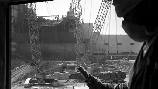 A worker measures radiation levels following an explosion at the Chernobyl Nuclear Power Plant.