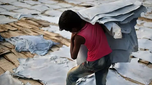 A ten year old works at a leather tannery in Bangladesh, where enforcing international laws against child labor in the supply chain is increasingly difficult.