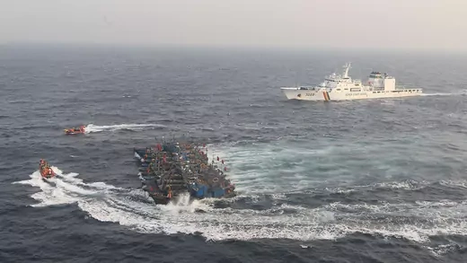 South Korean coast guard ships attempt to stop Chinese boats allegedly fishing illegally in the Yellow Sea.