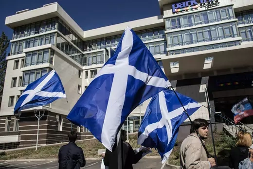 People hold Scotish flags during a rally in support of Scotland's independence referendum, in Donetsk, eastern Ukraine, September 18, 2014.