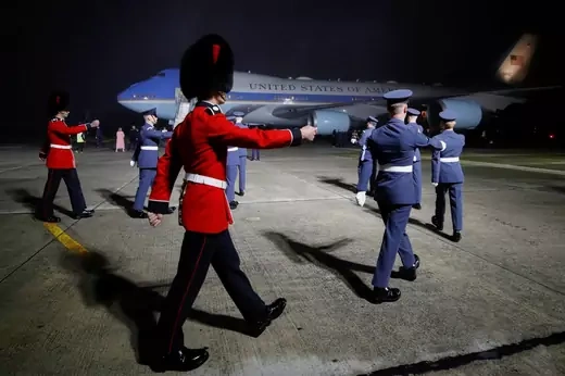 Military personnel march to welcome U.S. President Joe Biden and first lady Jill Biden upon the evening arrival of Air Force One at Cornwall Airport in Britain on June 9, 2021. 