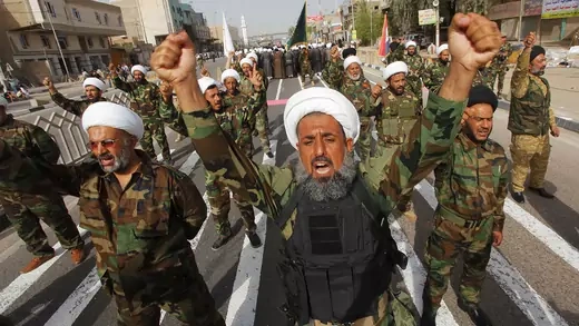 Mehdi Army fighters loyal to Shi'ite cleric Moqtada al-Sadr march during a parade in Naja.