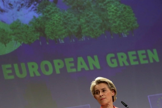 European Commission President Ursula von der Leyen looks on during a news conference to present the EU's new climate policy proposals, with a screen displaying trees and “European Green” behind her, in Brussels, Belgium on July 14, 2021. 