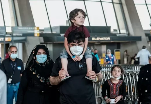 Afghan refugees arrive at Dulles International Airport in Virginia in August 2021.