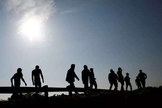 Migrants from Central America walk after being detained by  U.S. Customs and Border Protection (CBP) agents after crossing into the United States from Mexico, in Sunland Park, New Mexico, U.S., July 15, 2021. REUTERS/Jose Luis Gonzalez