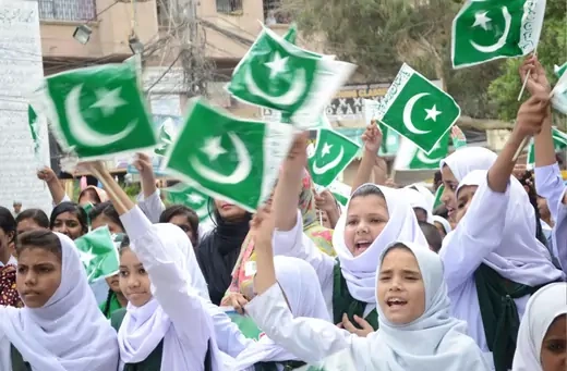 School girls holds Pakistani flags during the rally in connection of 70th Independence day of Pakistan out side Hyderabad press club.