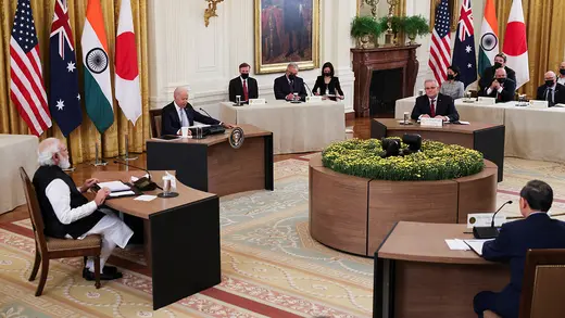 Leaders of the Quad countries sit at separate tables during a meeting at the White House.