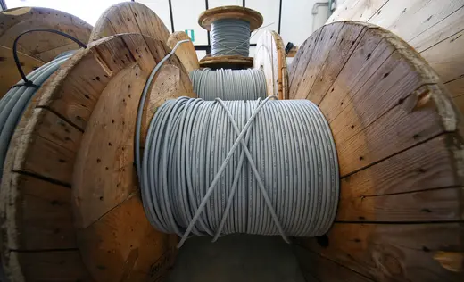 Reels of optical fiber cables are seen in a storage area in Perugia, Italy, June 23, 2017.