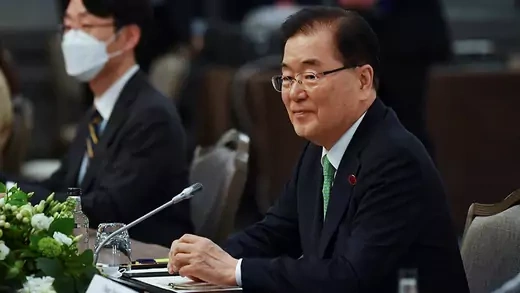South Korean Foreign Minister Chung Eui-yong sitting at a table during a trilateral meeting