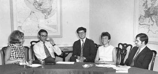 Black and white 1970 photograph of five CFR term members, two women and three men, seated at a large table. Maps hang in the background.