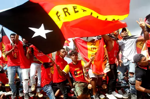 Supporters of the FRETILIN political party fly red, yellow, and black flags ahead of parliamentary elections in Tasi Tolu, Dili, in East Timor.
