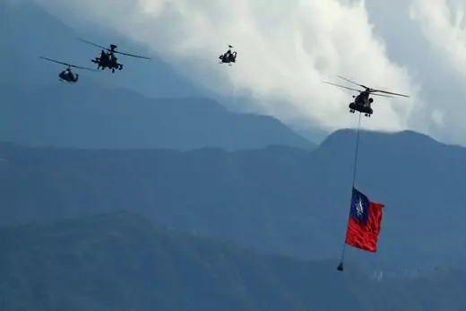 Military helicopters carrying tremendous Taiwan flags conduct a flyby rehearsal ahead of National Day celebration, near Taipei 101 , amid escalating tensions between Taipei and Beijing, China, in Taipei, Taiwan 7 October 2021.