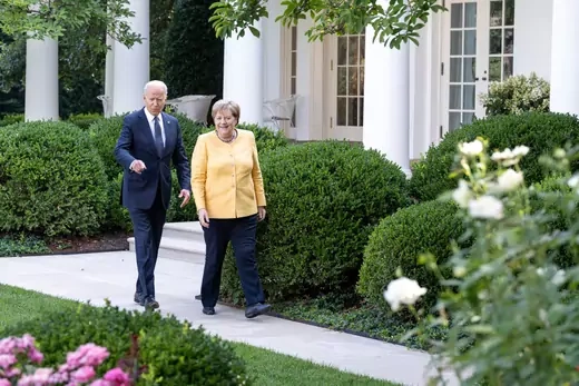 Joe Biden and Angela Merkel walk together at the White House