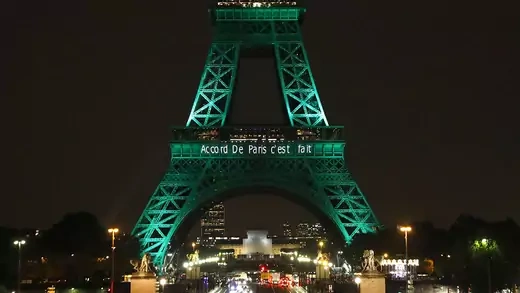 The Eiffel Tower is illuminated to celebrate the first day of the application of the Paris climate accord.