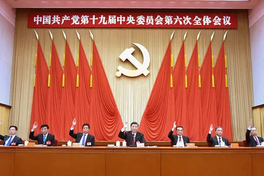 Xi Jinping sits next to top Chinese officials.