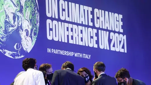 Delegates talk during the UN Climate Change Conference (COP26) in Glasgow, Scotland