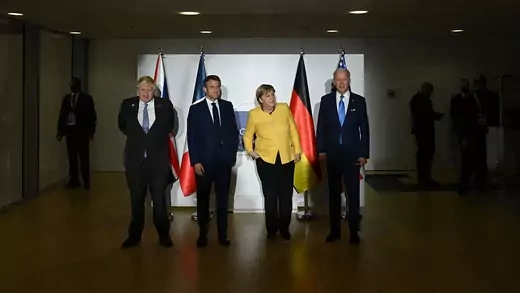 British Prime Minister Boris Johnson, French President Emmanuel Macron, German outgoing Chancellor Angela Merkel, and US President Joe Biden pose within a meeting about the JCPOA on the sidelines of the G20 of World Leaders Summit