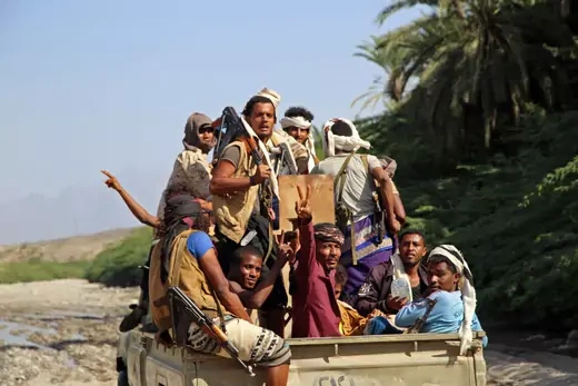 Fighters loyal to Yemen's Saudi-backed government patrol in the Maqbana area of Yemen's southwestern province of Taez, on December 13, 2021.