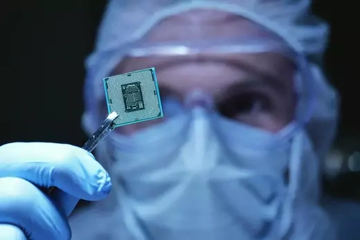 Scientist holds up a microchip