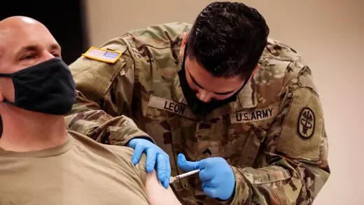 A U.S. Army reserve soldier receives the COVID-19 vaccine at Camp Shelby, Mississippi, in August 2021.