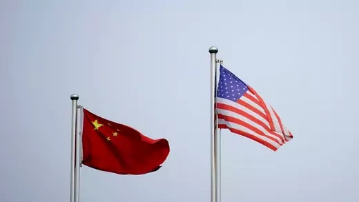 China's flag next to the United States' flag.