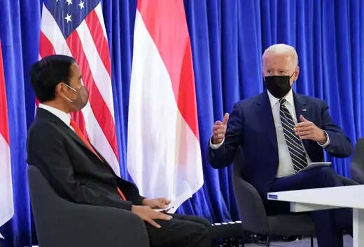 U.S. President Joe Biden gestures as he speaks to Indonesian president Joko Widodo.