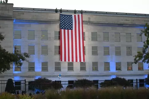 An American flag hangs from the side of the Pentagon to commemorate the 20th anniversary of the 9/11 attacks, on September 11, 2021, in Washington, DC.