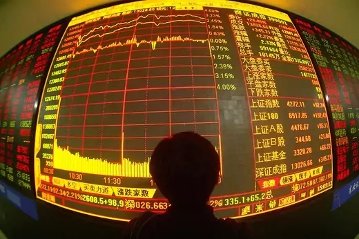 An investor views stock prices on monitors at a securities company on May 28, 2007 in Changchun of Jilin Province, China. Chinese stocks hit new highs today with the benchmark Shanghai Composite Index closing at 4,272.11 points, up 2.21 percent, as the total number of share trading accounts in the country topped 100 million.