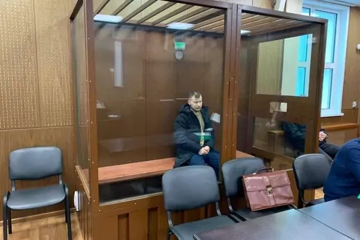 Ruslan Khansvyarov sits in court in Moscow following his arrest for involvement in the REvil ransomware gang.