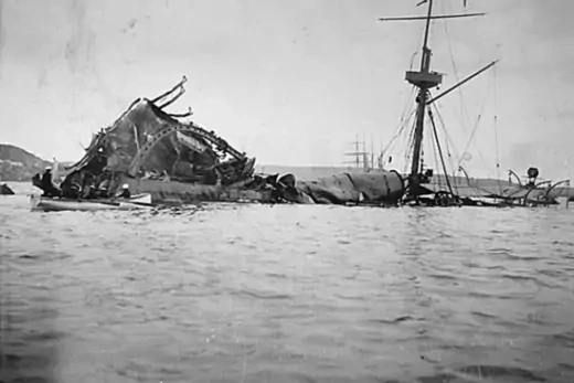 The wreckage of the USS Maine lies partially submerged in Havana Harbor. 