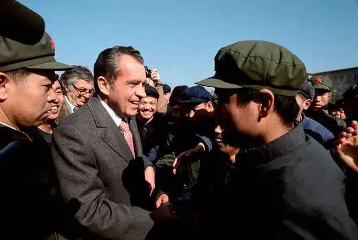 Richard Nixon shakes hands with Chinese citizens in Tianannen Square during a visit to China as a private citizen.