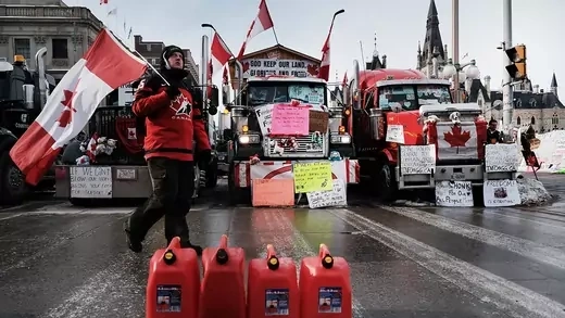 Hundreds of truck drivers and their supporters block the streets of downtown Ottawa in February 2022 as part of a convoy of protesters against COVID-19 restrictions in Canada.