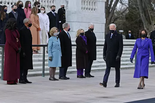 President Joe Biden and Vice President Kamala Harris walk in front of former Presidents Barack Obama, George W. Bush, and Bill Clinton and their wives at Arlington National Cemetery's Tomb of the Unknown Soldier.