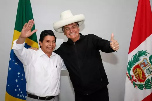 Peruvian President Pedro Castillo and his Brazilian counterpart, Jair Bolsonaro, smile for the camera