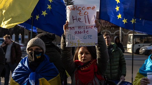 People participate in a protest outside the Russian Embassy on February 22 in Kyiv, Ukraine.