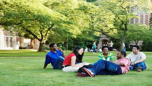 Students sitting together on campus. 