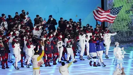 U.S. athletes walk during the Olympics opening cermony.