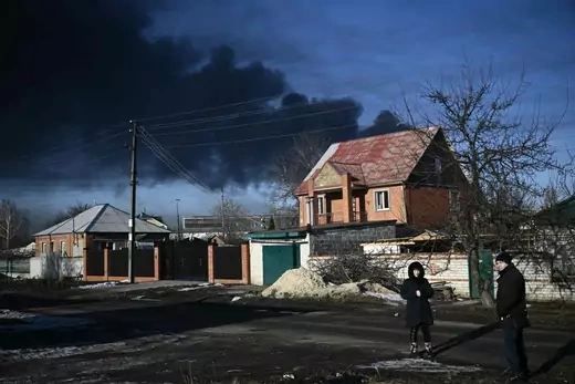 Black smoke rises from a military airport in Chuguyev near Kharkiv on February 24, 2022.