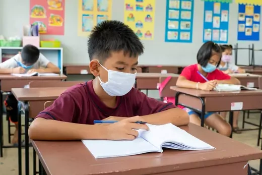 Elementary school students wear masks