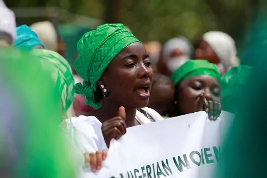 A Nigerian woman holds a placard during a protest for women’s rights.