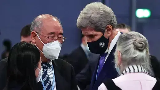 U.S. climate envoy John Kerry speaks with his Chinese counterpart, Xie Zhenhua.