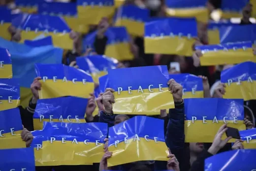 Fans display the Ukraine flag inside the stadium before the match in Italy.