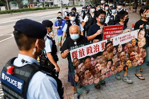 Pro-democracy protesters hold a banner during a protest urging for the release of political prisoners at Chinese National Day, in Hong Kong, China