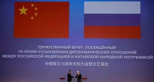Chinese President Xi Jinping and Russian President Vladimir Putin shake hands during a ceremony dedicated to the 70th anniversary of the establishment of diplomatic relations between Russia and China, in Bolshoi Theatre in Moscow, Russia June 5, 2019.