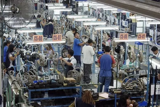 Photo showing Mexican workers working in electronics factory.